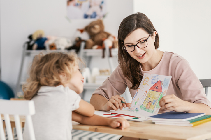 Teacher working with student